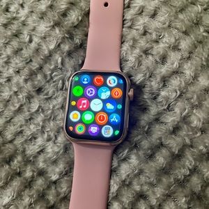 Fit bit smartwatch pink band gold face